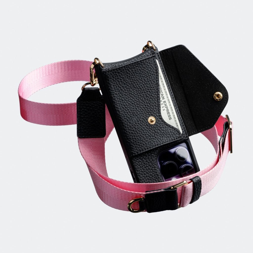 Black Bandolier-style leather crossbody phone case featuring a built-in wallet and secure card slots.