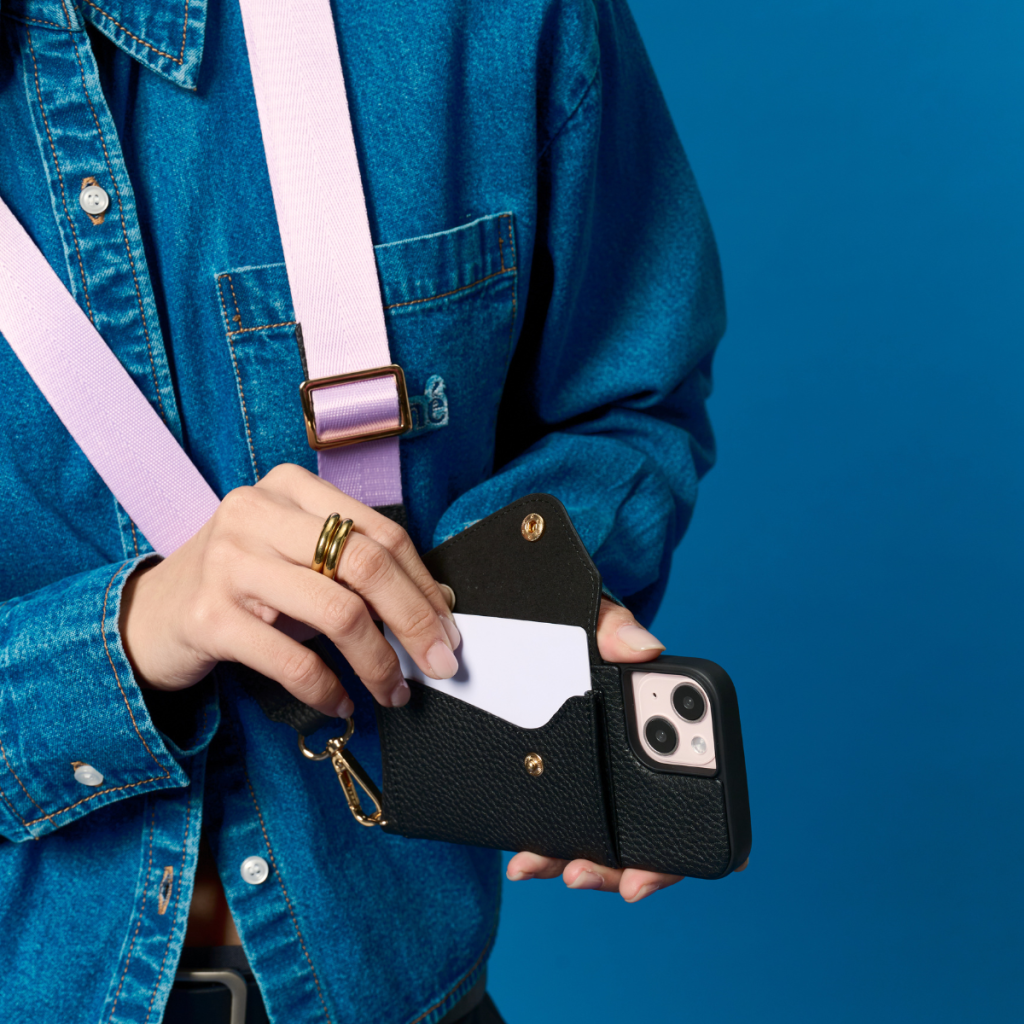 Black Bandolier-style leather crossbody phone case featuring a built-in wallet and secure card slots.